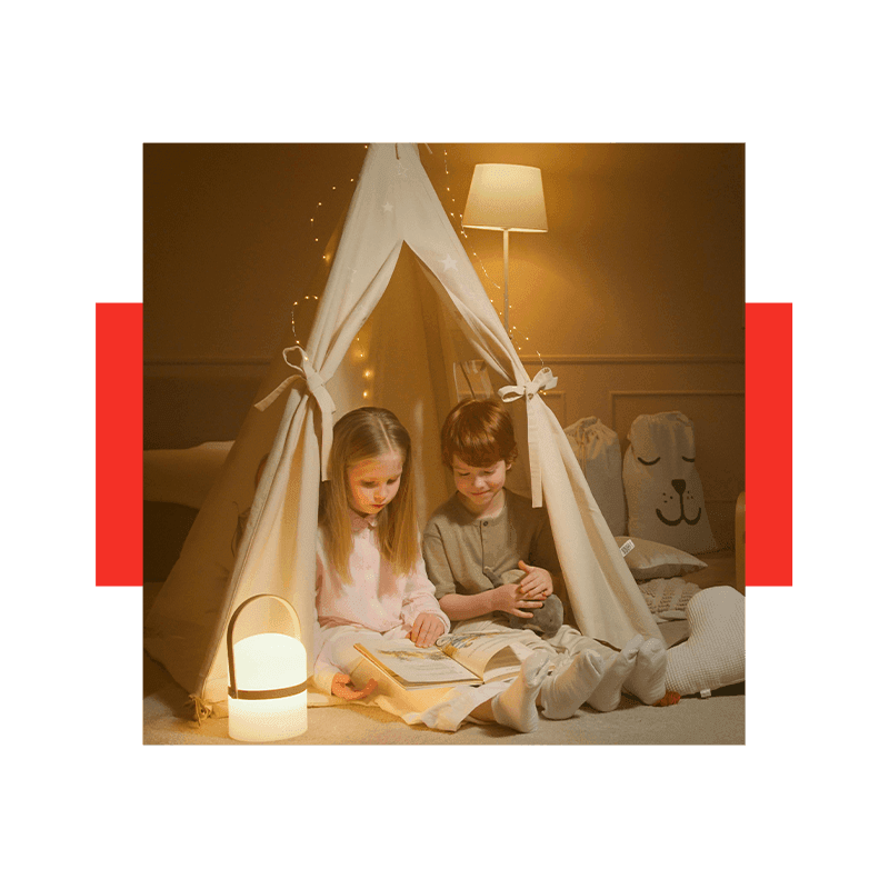 two kids doing indoor camping